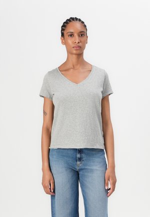 Gray short-sleeve V-neck t-shirt with a relaxed fit, made of soft fabric, displayed with light blue high-waisted jeans.