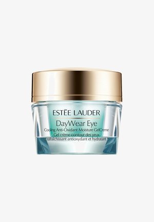 Estée Lauder DayWear Eye cream in a clear glass jar with a turquoise gel interior. Gold lid, label features black text with product details.
