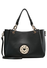 Musta tekonahkainen käsilaukku, jossa on kaksinkertaiset yläkahvat, kultaiset metalliosat ja keskellä pyöreä logo, jossa lukee "VALENTINO" ja sydänkuvio.