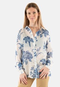 Bluză albă transparentă cu model floral albastru, design cu guler, cu închidere cu nasturi în față și mâneci lungi, având o croială lejeră și manșete cu buton.