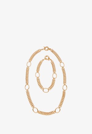 Guldtonet kædesmykke sæt med oval link-design, bestående af et halskæde og armbånd med skiftende glatte og teksturerede led.