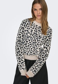 Leopardimustriga kampsun beežis ja mustas, pehme tekstuur, soonikkoes mansetid ja alumine serv, karbikujuline disain, pikkade varrukate ja ümar kaelusega.