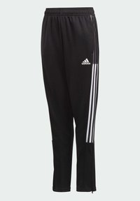 Pantalones deportivos negros hechos de tela sintética, con acentos de tres rayas blancas a lo largo de los costados y bolsillos con cremallera. Incluye cinturilla elástica.