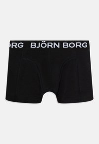 Crne bokserice s bijelim pojasom s logom "BJÖRN BORG". Izrađene od glatkog, rastezljivog materijala sa ojačanim šavovima i jednostavnim dizajnom.