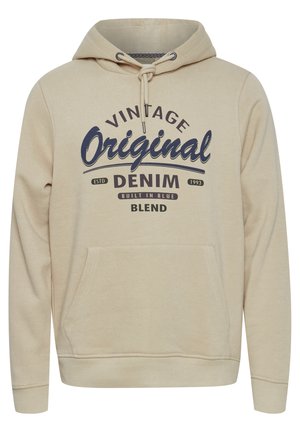 Beige hoodie featuring a front pocket, drawstring hood, and printed text in blue. Fabric has a soft texture, suitable for casual wear.