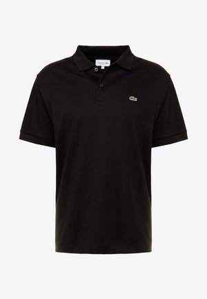 Polo shirt noir en coton à manches courtes, avec patte de boutonnage et logo crocodile vert Lacoste sur la poitrine gauche.