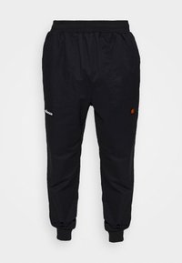 Pantalon de jogging noir fuselé avec taille élastique, chevilles resserrées, poches latérales et petits logos sur la cuisse gauche et la hanche droite.