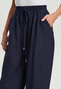 TUSSAH ANDREA - Hlače - navy blue