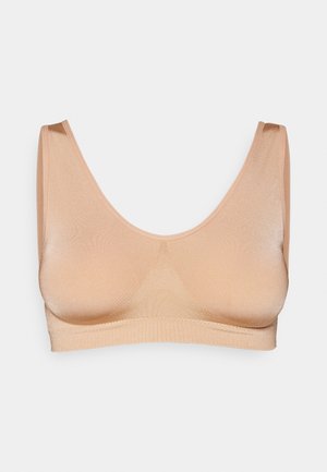 Beżowy, bezszwowy biustonosz typu braletka z okrągłym dekoltem, szerokimi ramiączkami i gładką teksturą. Prosty, minimalistyczny design bez zdobień.