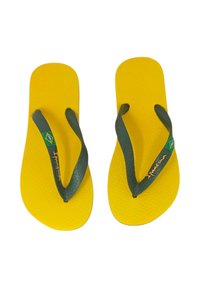 Infradito gialli con cinturini verdi, caratterizzati da una suola testurizzata e un piccolo dettaglio con la bandiera del Brasile. Nome del marchio "Ipanema" in oro.