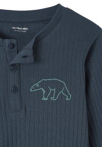 Dark blue ribbed long-sleeve toddler shirt with buttons and a light green outline of a walking bear on the chest.