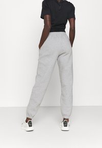 Reebok Tracksuit bottoms - grey