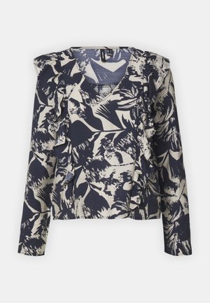 Blouse à manches longues à motif floral bleu marine et crème, avec un col en V et des accents volants sur le devant et les manches. Tissu doux.