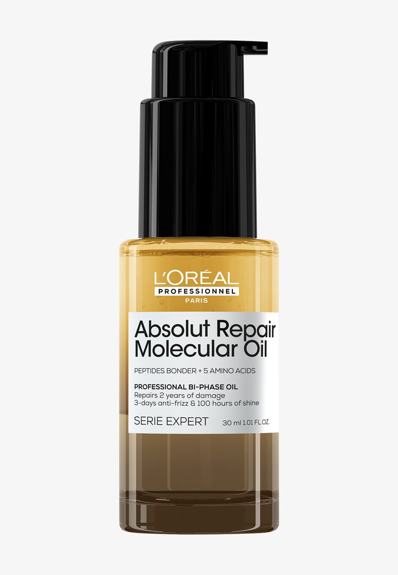 Aceite Molecular Absolut Repair de L'Oréal en una botella de vidrio transparente con un dispensador negro. Líquido amarillo, etiqueta blanca y negra con detalles del producto.