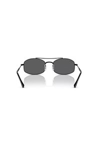 Occhiali da sole con una montatura in metallo nero elegante, lenti scure ovali, morbidi cuscinetti per il naso trasparenti e sottili aste nere. Design minimalista con curve sottili.