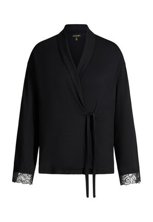 Cardigan noir style cache-cœur avec manches longues, bordure en dentelle aux poignets et fermeture à nouer à l’avant.