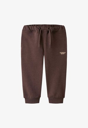 Pantalons de survêtement marron avec une taille élastique, un cordon de serrage et des poignets côtelés. Comprend des poches latérales et le texte "BASEBALL BEAST" en couleur claire.