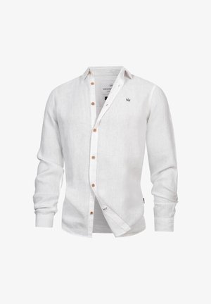 Weißes Leinenhemd mit langen Ärmeln, braunen Knöpfen und kleinem schwarzen, gesticktem Logo auf der linken Brustseite.