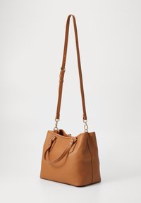 Brown pebbled leather handbag with a structured design, two short handles, and a detachable long strap. Gold-tone hardware accents.