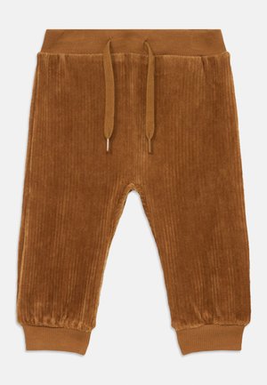 Pantaloni di velluto a coste marroni con una trama a righe, vita elasticizzata e coulisse. I polsini sono anch'essi elasticizzati, migliorando la vestibilità e il comfort.