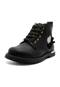Zwarte enkelboot van leer met goudkleurige veters, versierd met een sprankelend hartdetail en een gestructureerde rubberen zool.