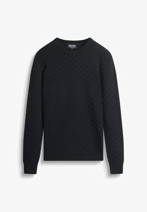 Pull noir à manches longues avec un motif carré texturé, col rond, et poignets et ourlet côtelés, posé à plat sur un fond blanc.