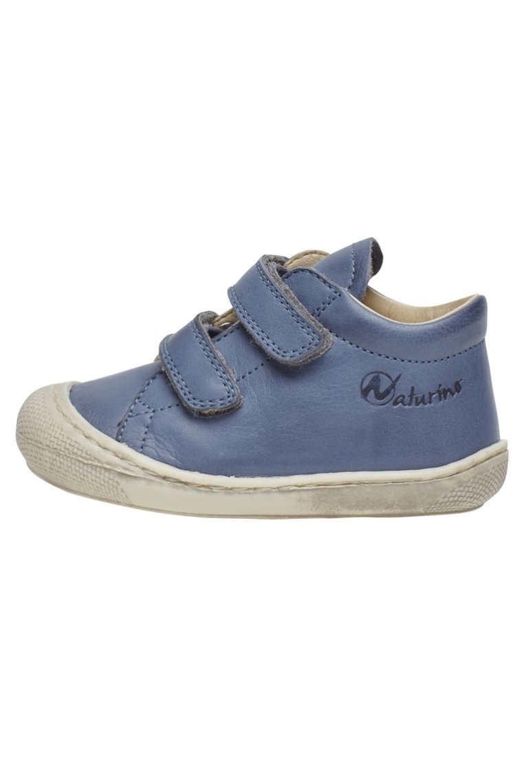 Blue toddler shoe with two velcro straps and a white rubber sole, showing slight wear.