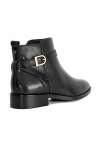 Black leather ankle boot with a low block heel, side buckle detail, smooth texture, and clean lines, featuring a rounded toe and minimalistic design.