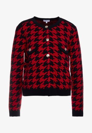 Czarny i czerwony kardigan w wzór houndstooth z długimi rękawami, okrągłym dekoltem i złotymi guzikami. Posiada dwie przednie kieszenie.