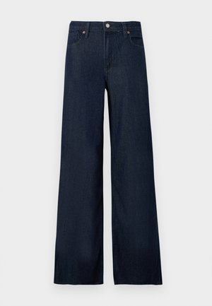 Jean denim bleu foncé à jambes larges avec bouton à l'avant, passants pour ceinture et style cinq poches sur fond uni.