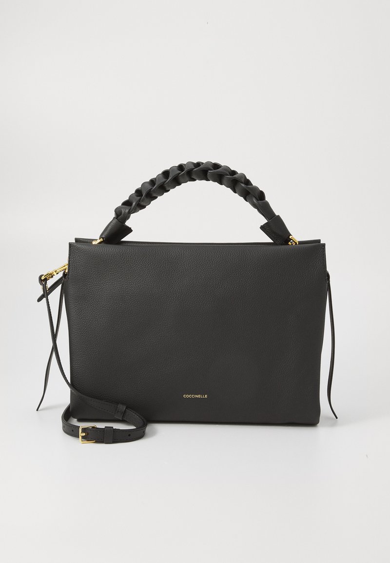 Black leather handbag with a braided handle, smooth texture, zip closure, gold hardware, and an adjustable shoulder strap. Brand logo visible.