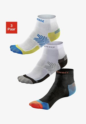 Three pairs of ankle socks in white, black, and gray, featuring mesh panels, colorful toe and heel accents, and a textured design for grip.