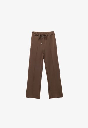 Braune weit geschnittene Hose aus weichem Stoff, mit einem elastischen Bund und einem Kordelzug sowie dezenten Seitennähten für Details.