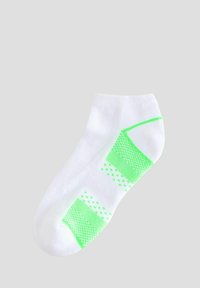 Vitt ankelsocka i bomull med ett texturerat mönster i neongrön. Designen inkluderar geometriska former och prickiga detaljer.