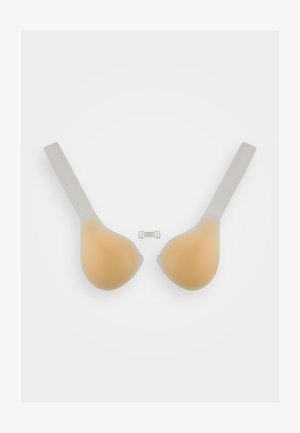 Copas de sujetador adhesivas de silicona en color beige con tiras transparentes. Textura suave, forma redondeada y un pequeño clip de plástico incluido para su sujeción.
