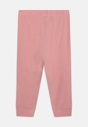 Rózsaszín, puha pamut leggings, elasztikus derékrésszel és szűkített mandzsettával a bokán. Egyszerű, egyszínű dizájn.