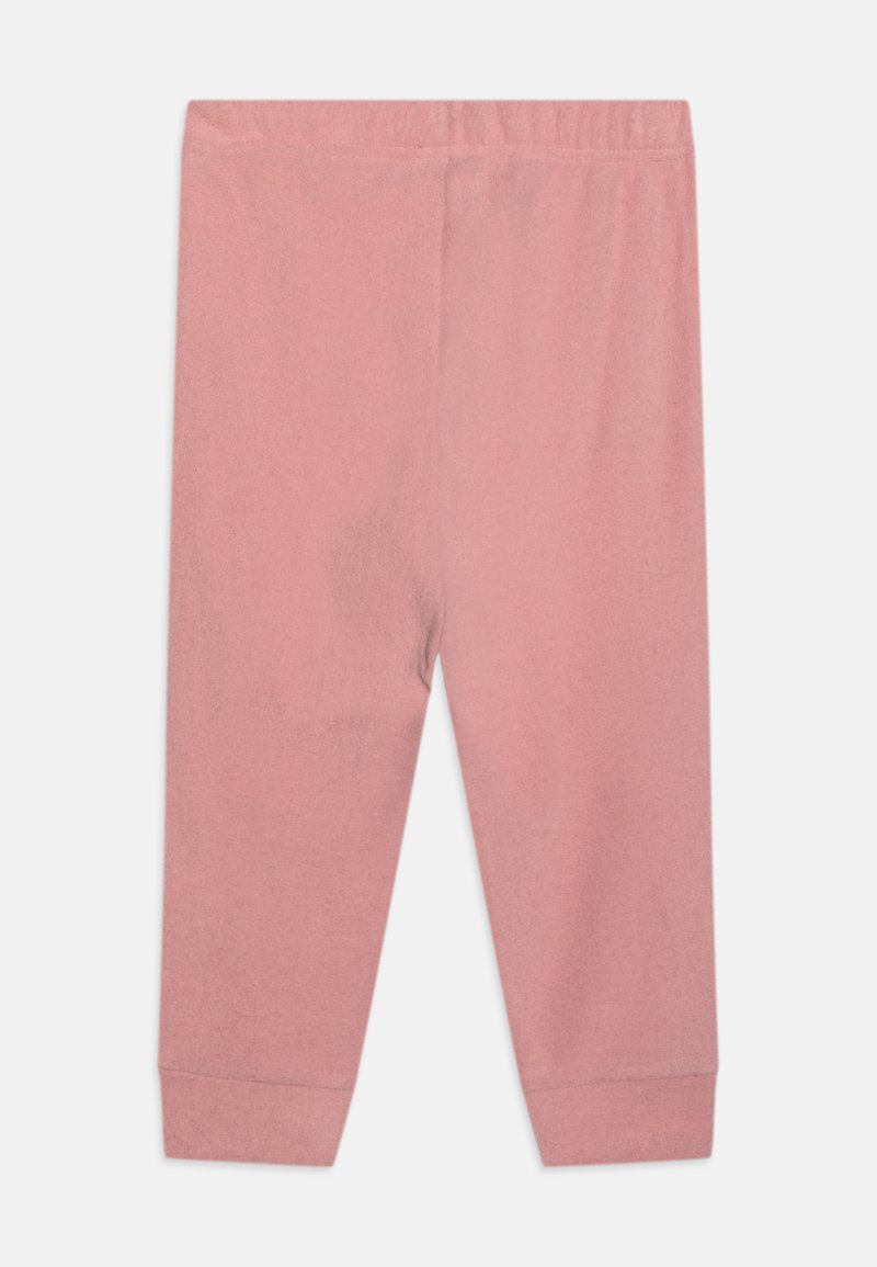 Roze pamučne tajice s mekim teksturom, s elastičnom gumom u struku i uskim manžetama na gležnjevima. Jednostavan, jednobojni dizajn.