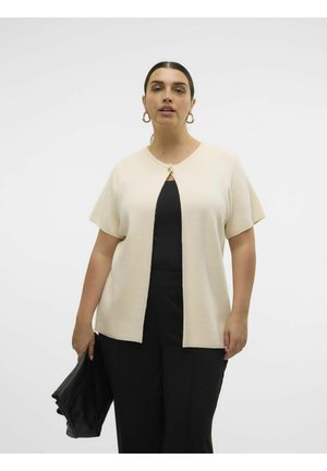 Beige short-sleeve cardigan with a round neckline, featuring a keyhole opening and a button detail, paired with black bottoms and a black clutch.