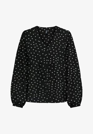 Svart bluse med lange pufferm, V-hals, frontlukking med knapper og spredt hvitt blomster mønster. Myk tekstur.