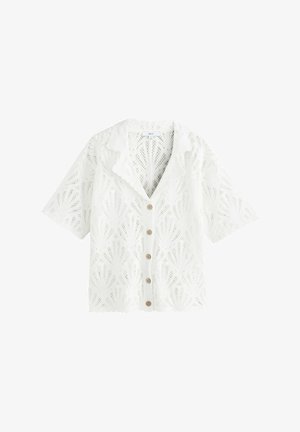 White short-sleeve lace blouse with scalloped edges, a collar, and five wooden buttons down the front.