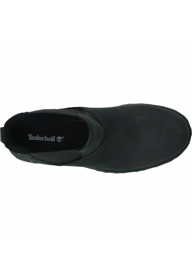 Scarpa nera senza lacci con finitura liscia, punta arrotondata e dettagli elastici ai lati. Logo Timberland visibile sulla soletta. Suola in gomma.
