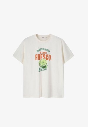 T-shirt en coton crème avec un imprimé graphique affichant un texte vert et orange ainsi qu'une illustration de citron vert. Encolure ras du cou, manches courtes, coupe décontractée.