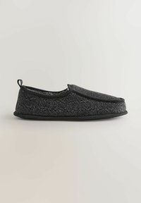 Pantofole nere con parte superiore in maglia testurizzata, forma arrotondata, rivestimento morbido, suola ammortizzata e un passa-mano sul retro per facilitarne l'indossamento.