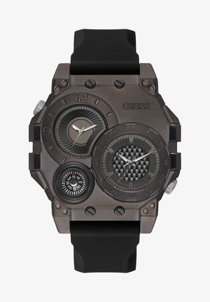 Bronzas krāsas Guess rokas pulksteņi ar lielu kvadrātu korpusu, melnu gumijas siksnu, trim ciparnīcām un kompasu, ar teksturētām akcentēm.