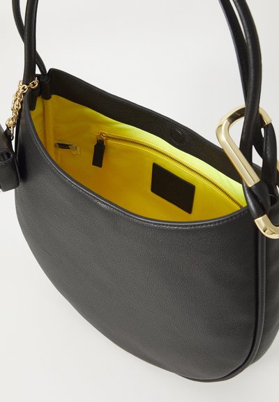 Black leather handbag with a rounded shape. Yellow fabric interior featuring a zippered pocket. Gold hardware accents on handles.