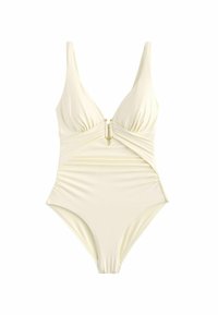 Eén-delig badpak in zachte crème stof, met een diepe V-hals, gatherdetails en gouden hardware-accent in het midden.
