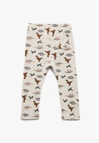 Katoenen legging met een crèmekleurige achtergrond versierd met kleurrijke dino-afdrukken in bruin, grijs en groen, met een gestikte achterzak.