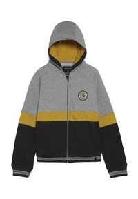 Mikina s kapucí na zip v šedé, hořčicové a černé barvě, s kulatým logem značky na levé hrudi a předními kapsami.
