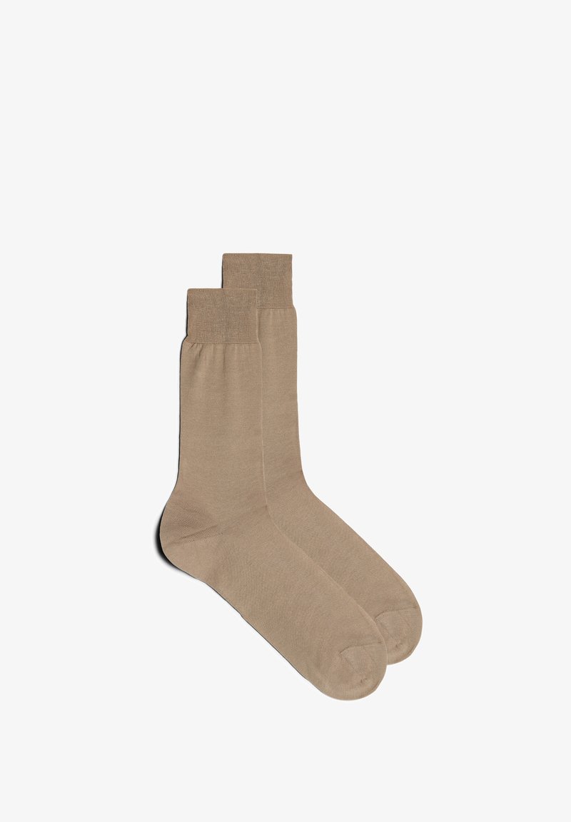 Beige Knöchelsocken aus glattem Material, mit gerippten Bündchen und einem einfachen Design. Die Textur ist weich, ohne sichtbare Muster oder Akzente.
