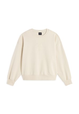 Sudadera color crema con mangas largas, cuello redondo y puños acanalados. Presenta texto en relieve en la parte delantera y un ajuste holgado.